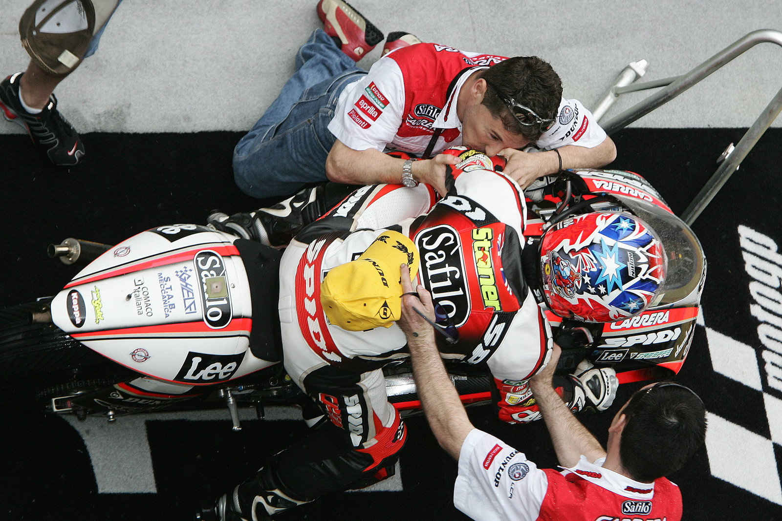 Cecchinello kisses Stoner in celebration, Chinese 250GP Race 2005