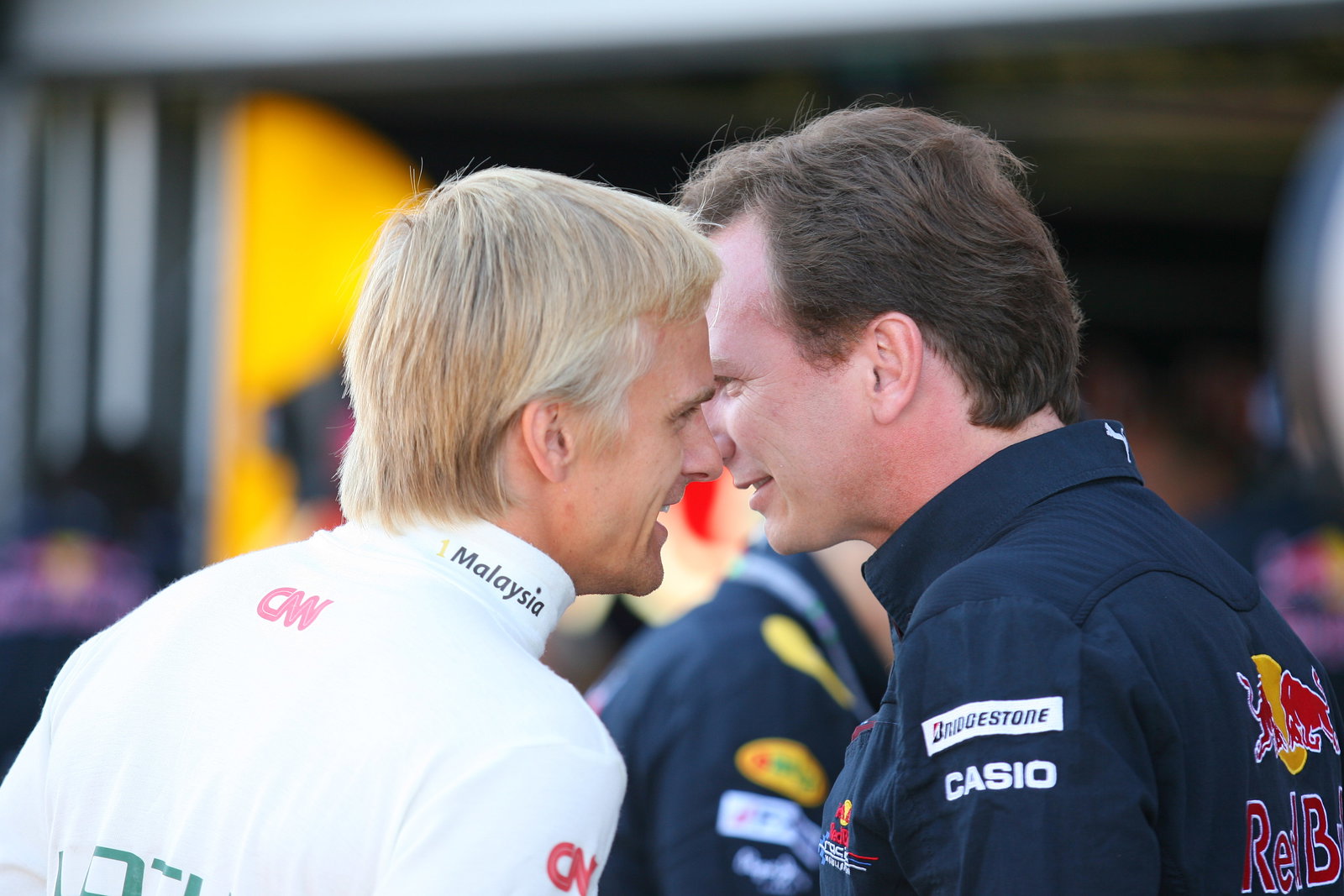 Friday Practice 1, Heikki Kovalainen (FIN), Lotus Racing, T127 and Christian Horner (GBR), Red Bull