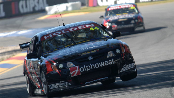 Team Dynamik`s Simon Wills getting maximum attitude from his V8 beast.