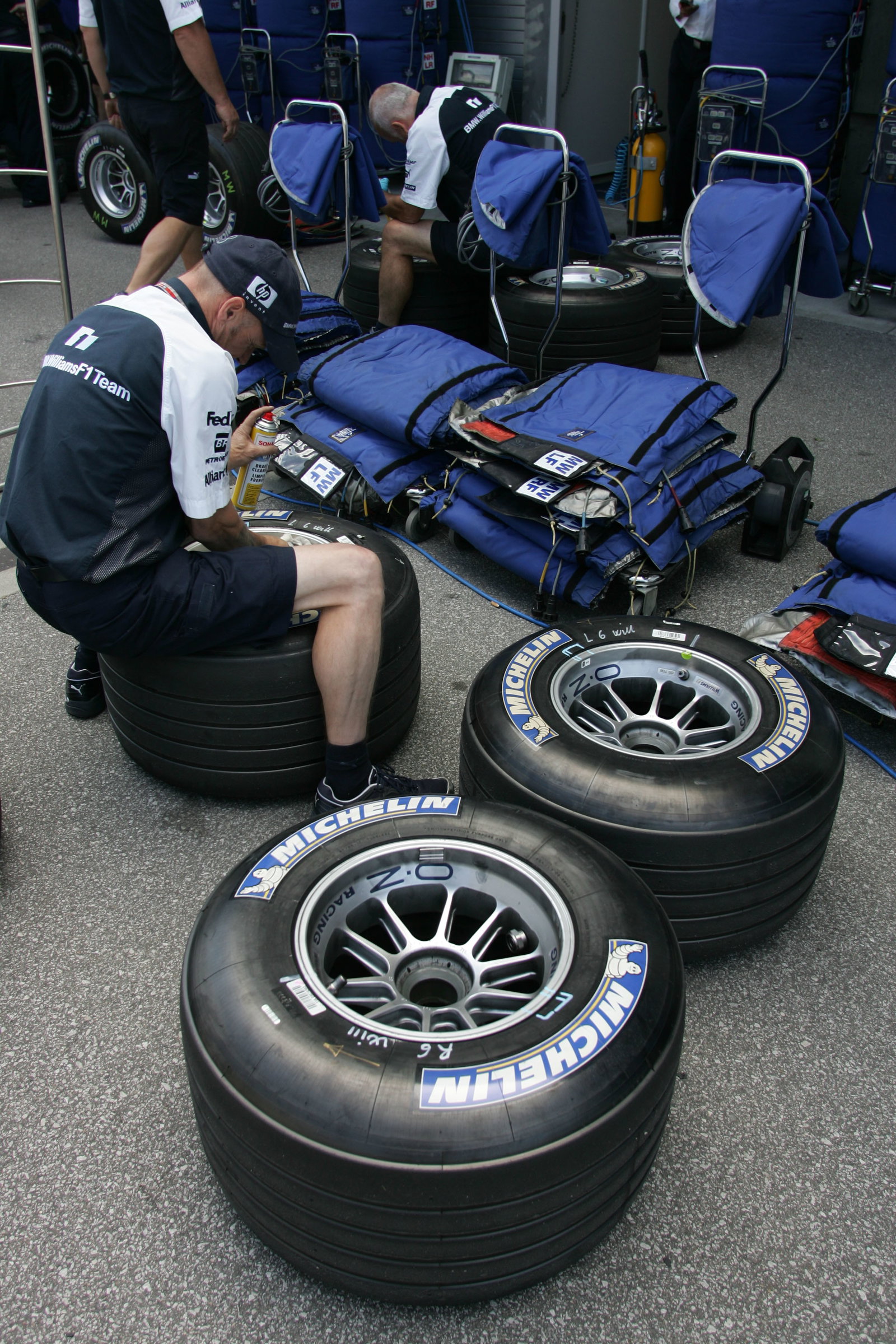 Williams mechanics work with the Michelin tyres that are causing the teams a problem at the United S
