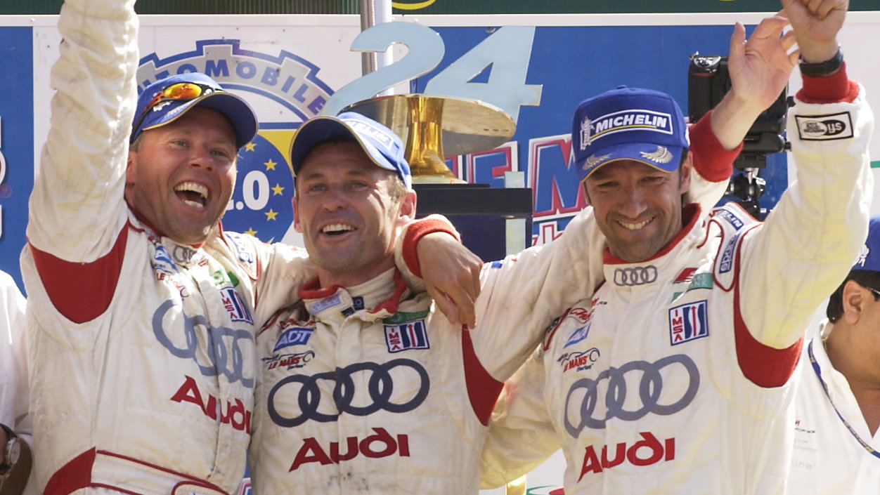 Tom Kristensen/Marco Werner/J.J. Lehto celebrate victory in the 2005 Le Mans 24 Hours.