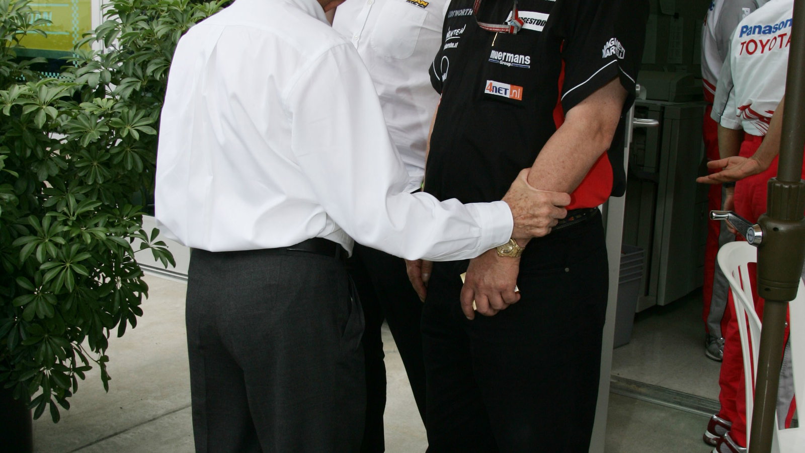 Bernie Ecclestone talks with Paul Stoddart prior to the United States Grand Prix