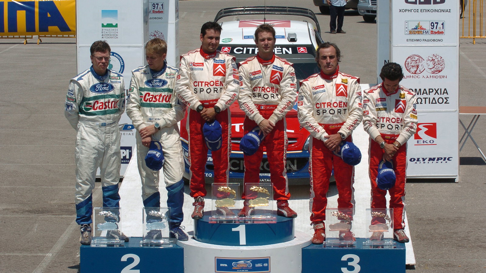 Acropolis Rally winners, Sebastien Loeb and Daniel Elena on the podium with Toni Gardemeister and J