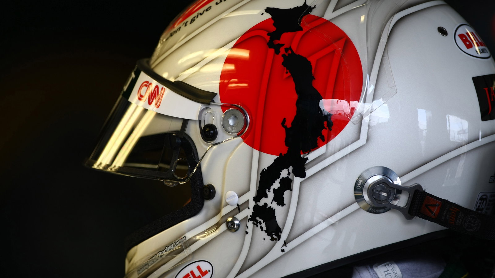 25.03.2011- Friday Practice 2, Jarno Trulli (ITA), Team Lotus, TL11 with a message for Japan