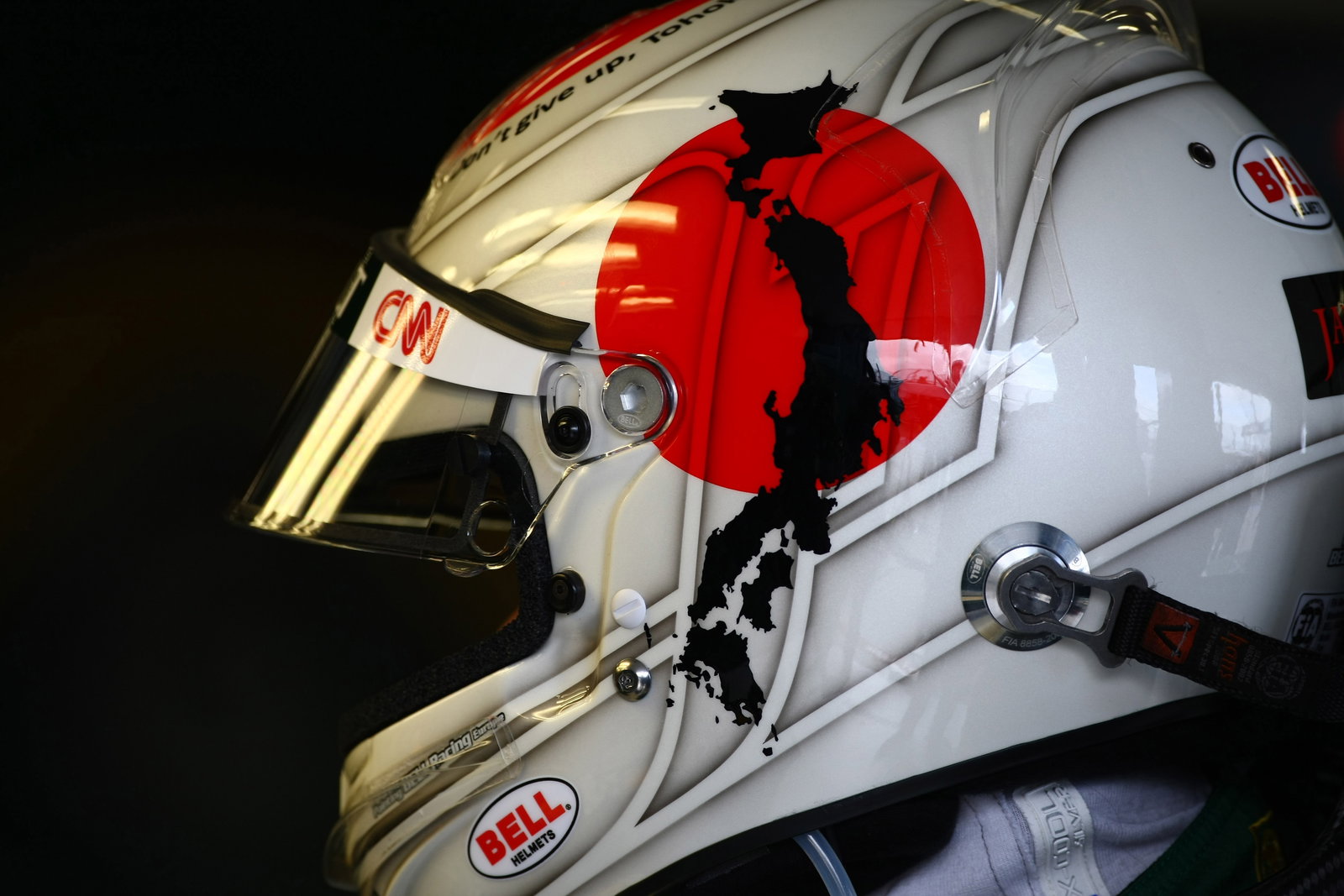 25.03.2011- Friday Practice 2, Jarno Trulli (ITA), Team Lotus, TL11 with a message for Japan