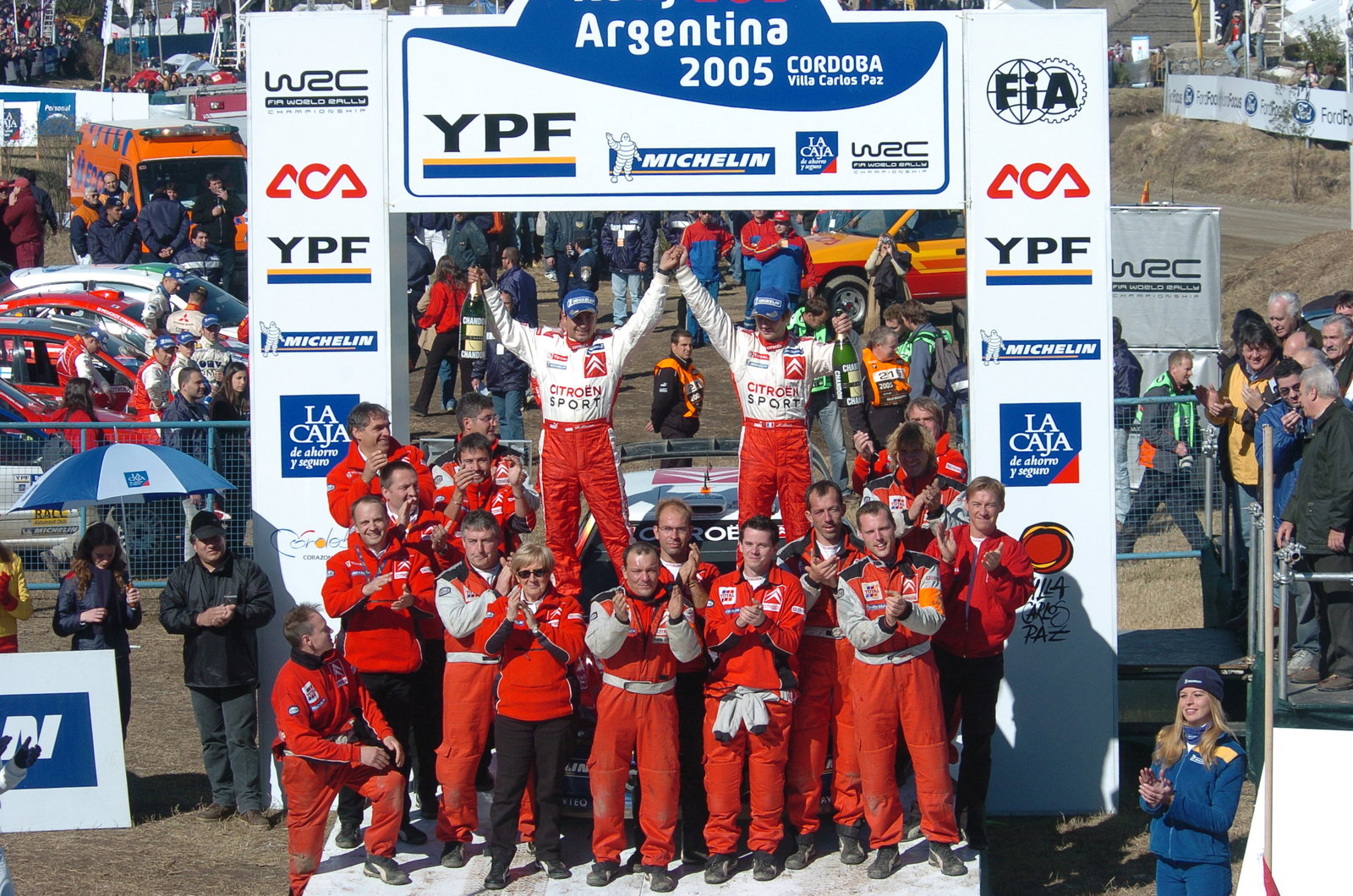 Sebastien Loeb and co-driver, Daniel Elena celebrate with the rest of the Citroen team after winning
