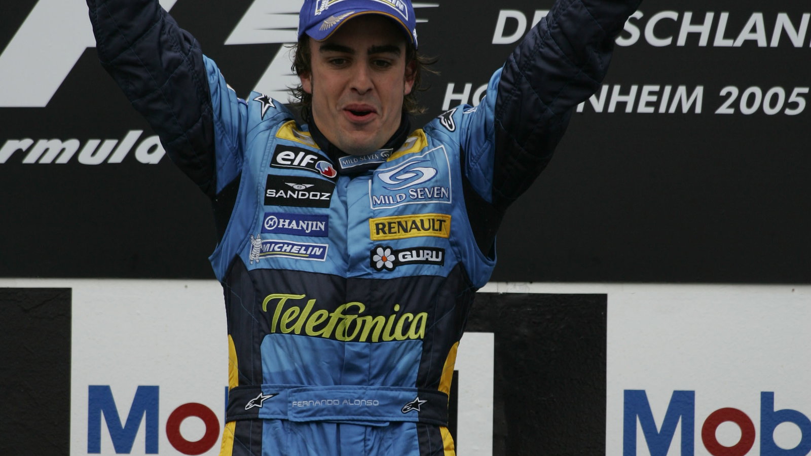 Race winner Fernando Alonso celebrates after the German Grand Prix