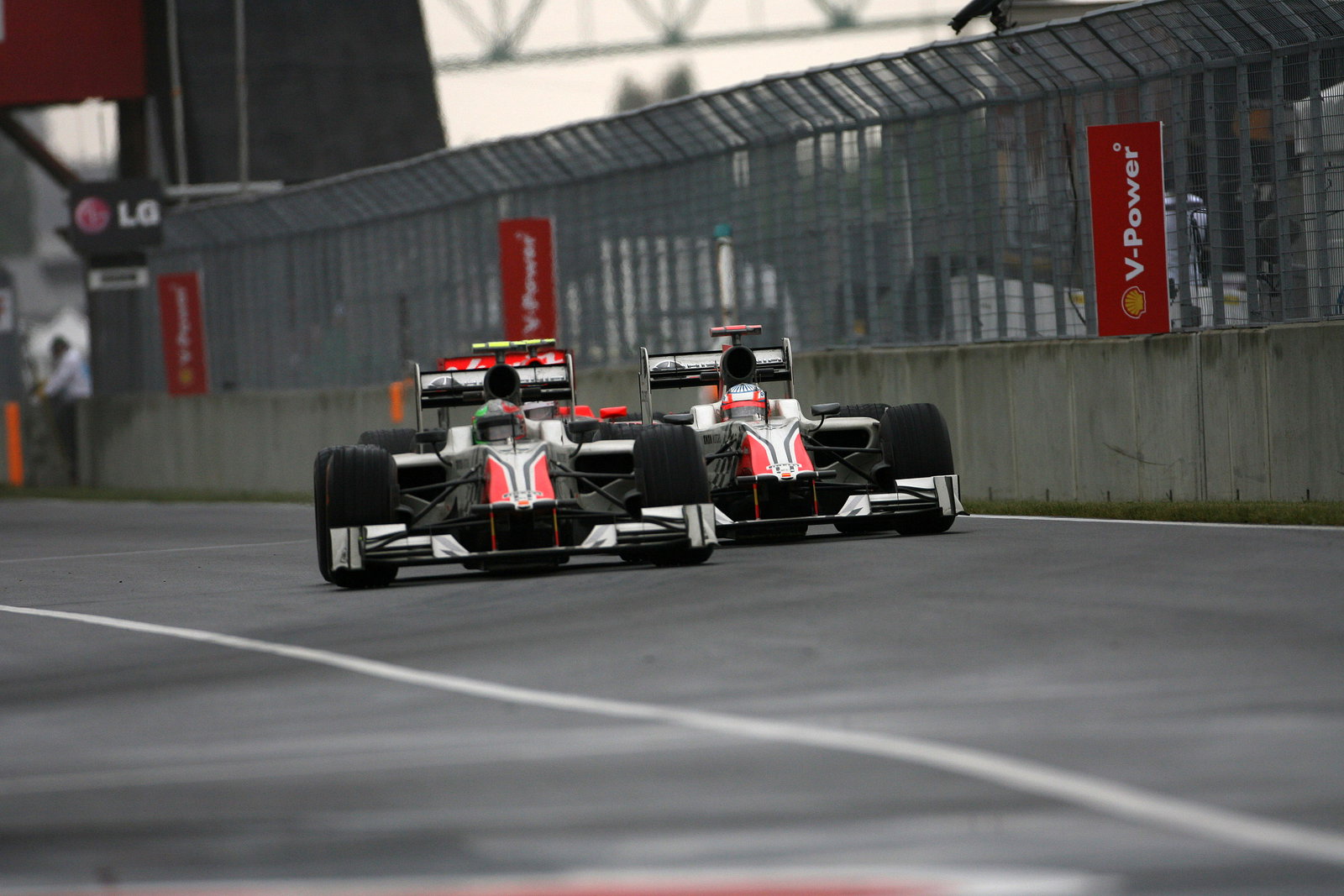 12.06.2011- Race, Vitantonio Liuzzi (ITA), Hispania Racing F1 Team, HRT and Narain Karthikeyan (IND