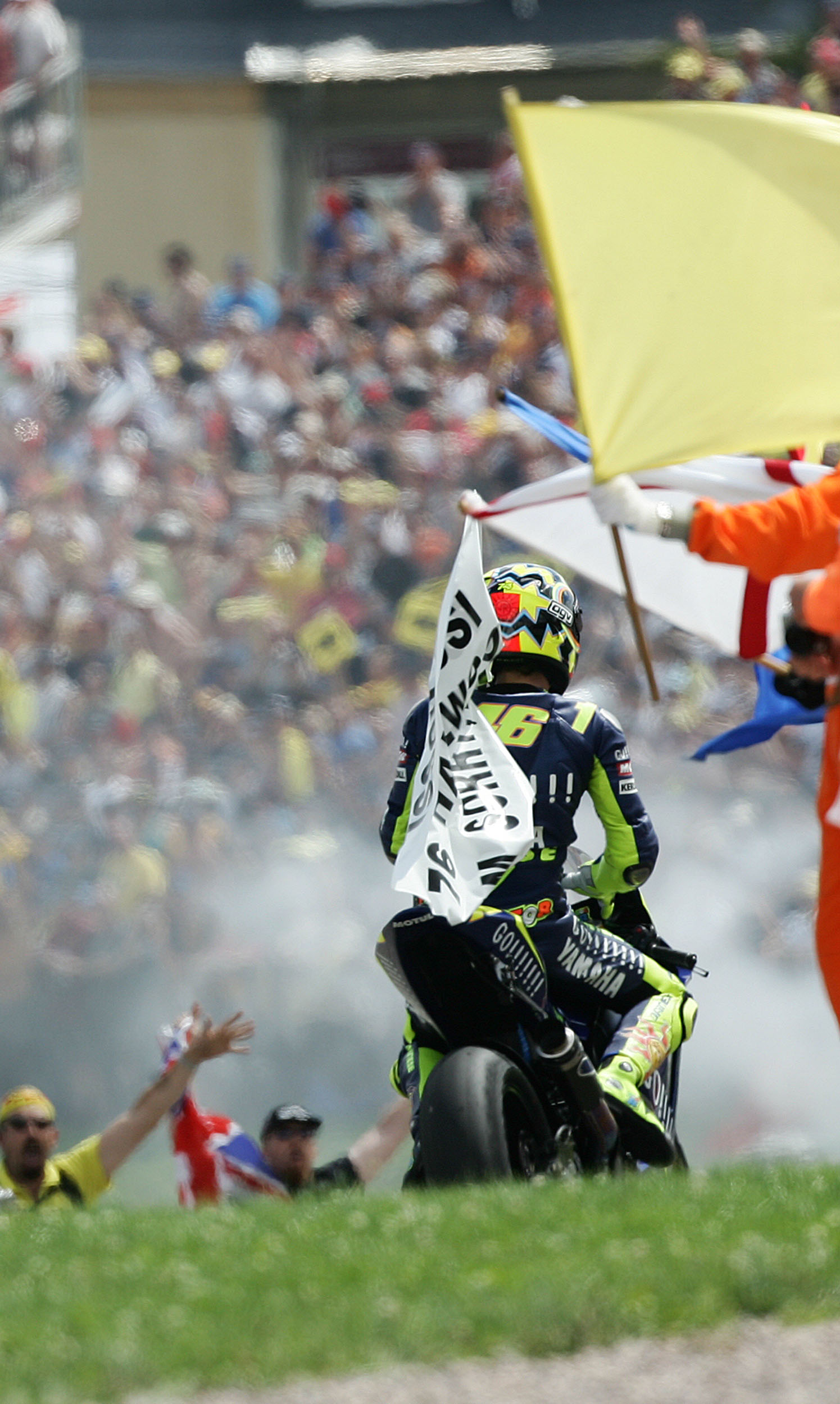 Rossi celebrates with Hailwood flag, German MotoGP, 2005