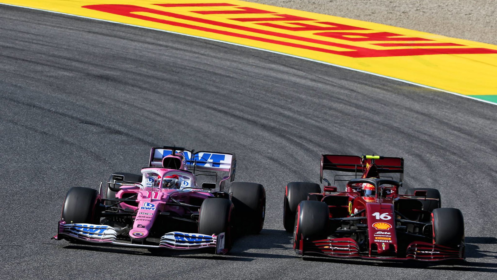 Sergio Perez (MEX) Racing Point F1 Team RP19 and Charles Leclerc (MON) Ferrari SF1000 battle for position.