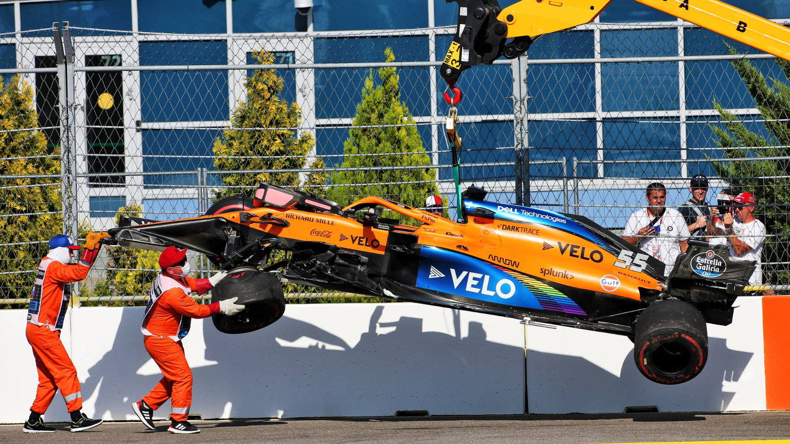 The McLaren MCL35 of race retiree Carlos Sainz Jr (ESP) McLaren is craned away from the circuit.