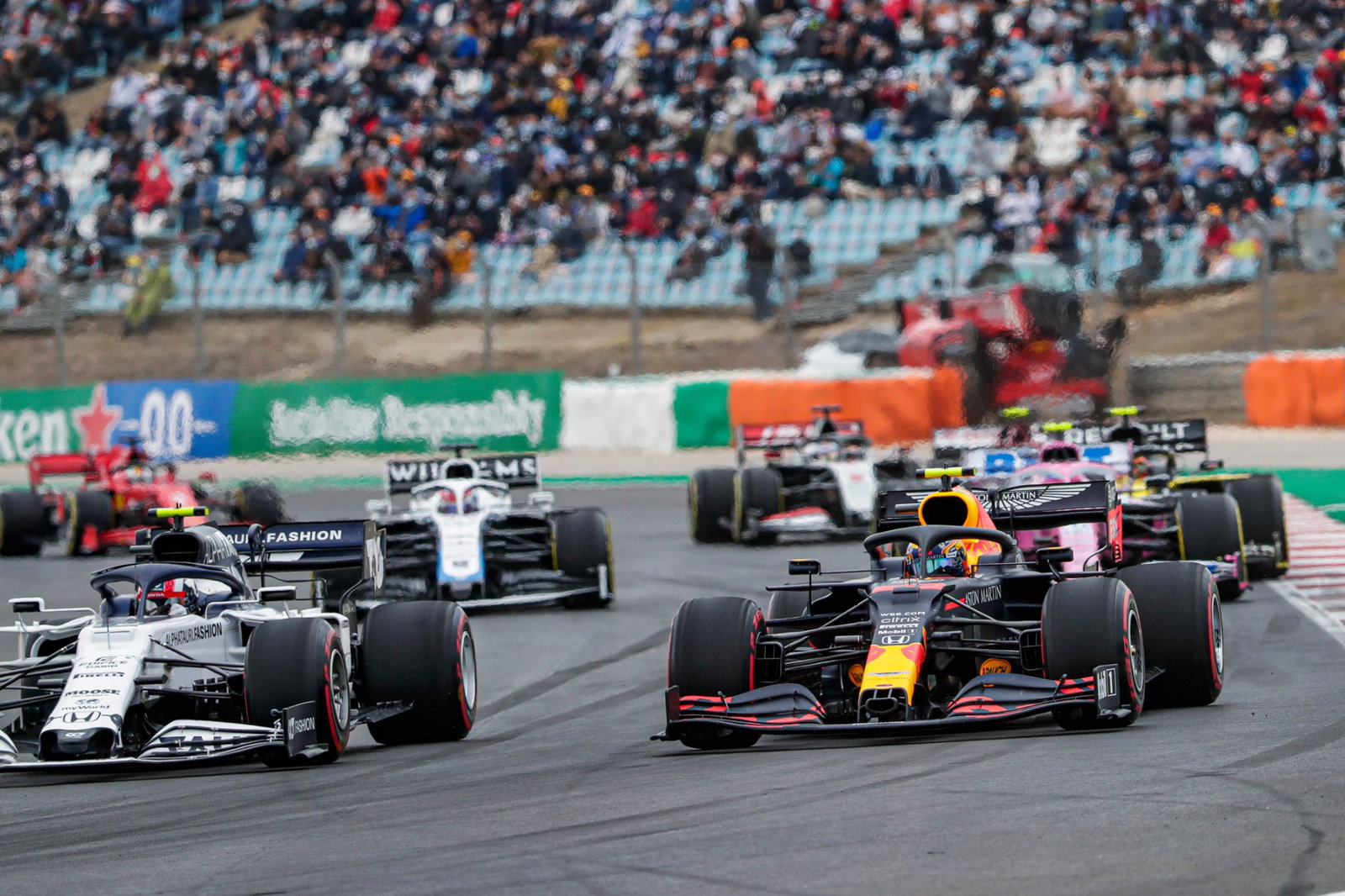 Pierre Gasly (FRA) AlphaTauri AT01 and Alexander Albon (THA) Red Bull Racing RB16 at the start of the race.