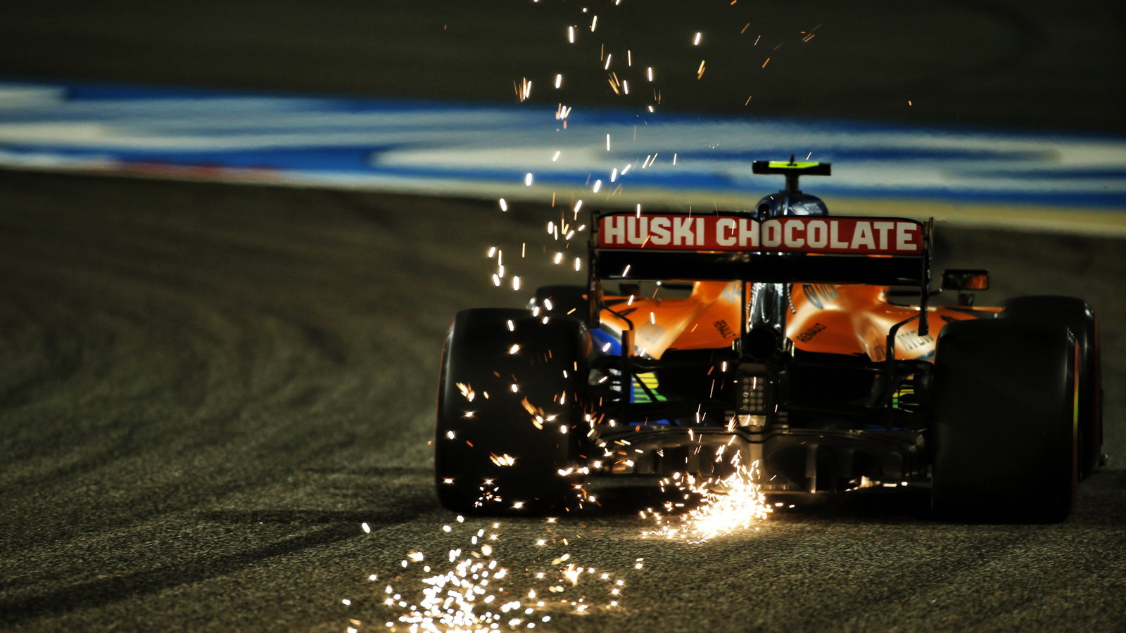 Lando Norris (GBR) McLaren MCL35 sends sparks flying.