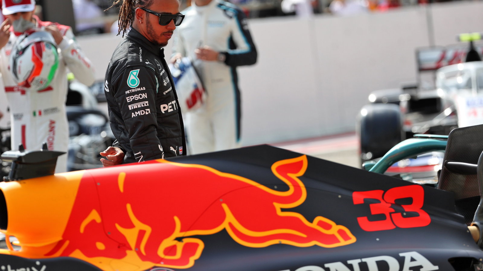 Lewis Hamilton (GBR) Mercedes AMG F1 looks at the Red Bull Racing RB16B.