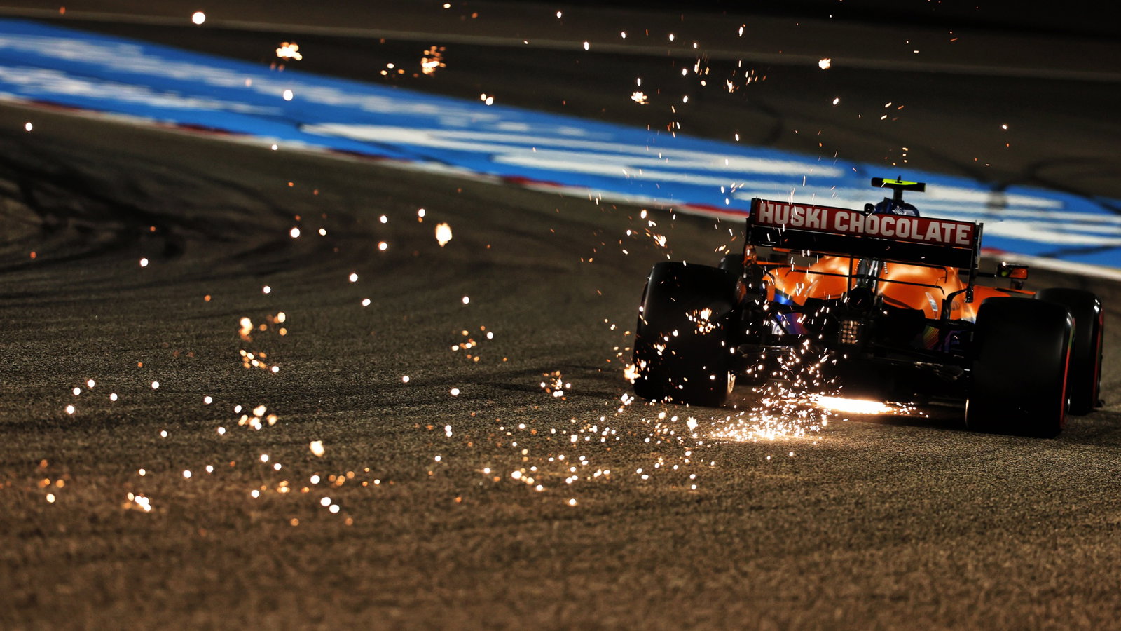 Lando Norris (GBR) McLaren MCL35M sends sparks flying.