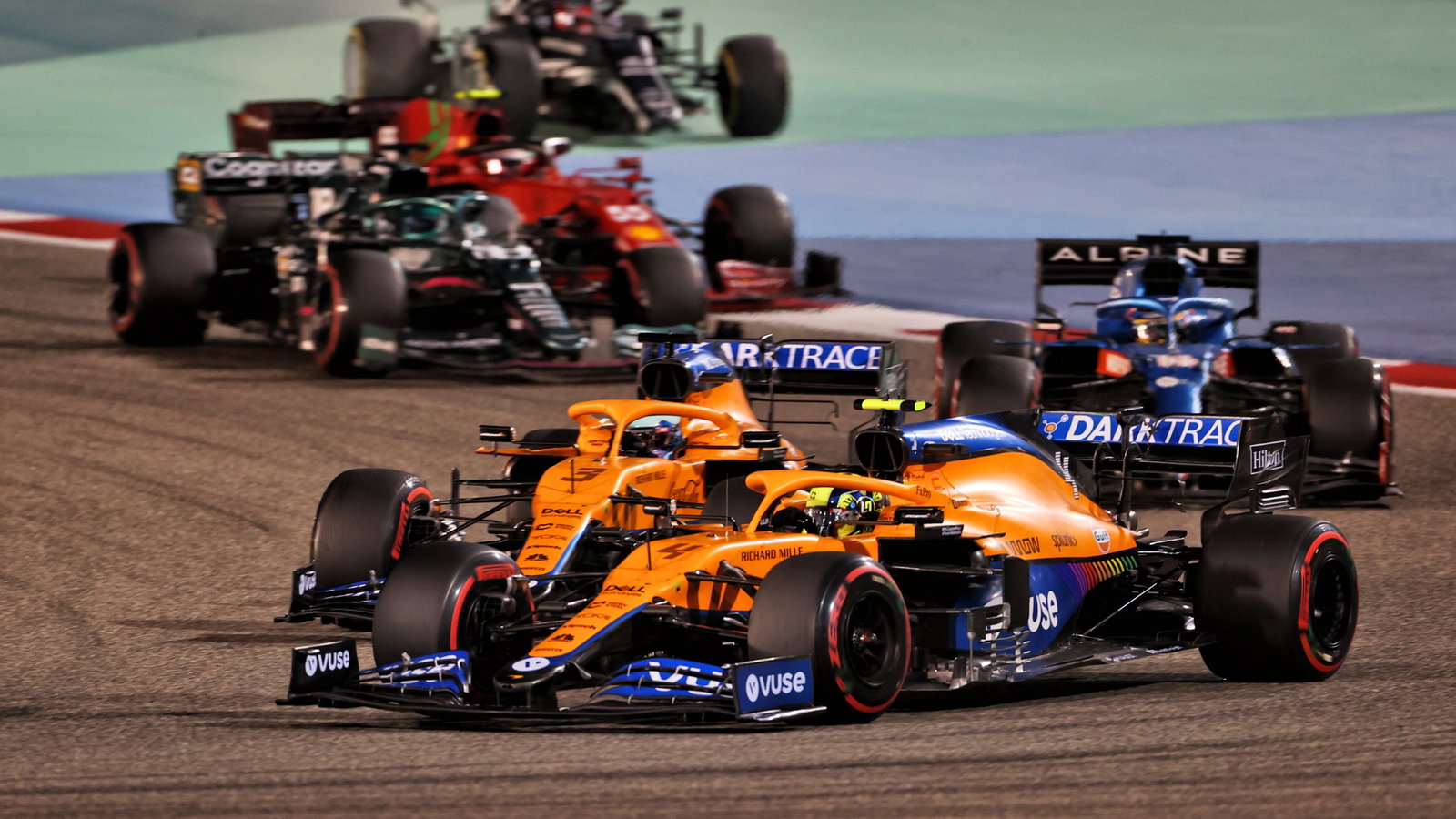 Lando Norris (GBR) McLaren MCL35M and Daniel Ricciardo (AUS) McLaren MCL35M battle for position.