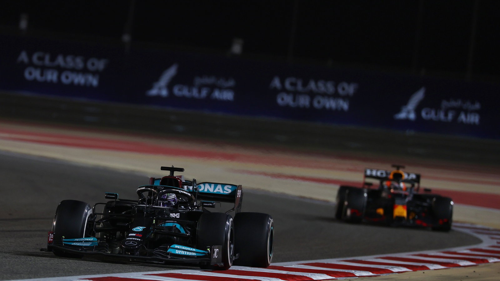 Lewis Hamilton (GBR) Mercedes AMG F1 W12 leads Max Verstappen (NLD) Red Bull Racing RB16B.