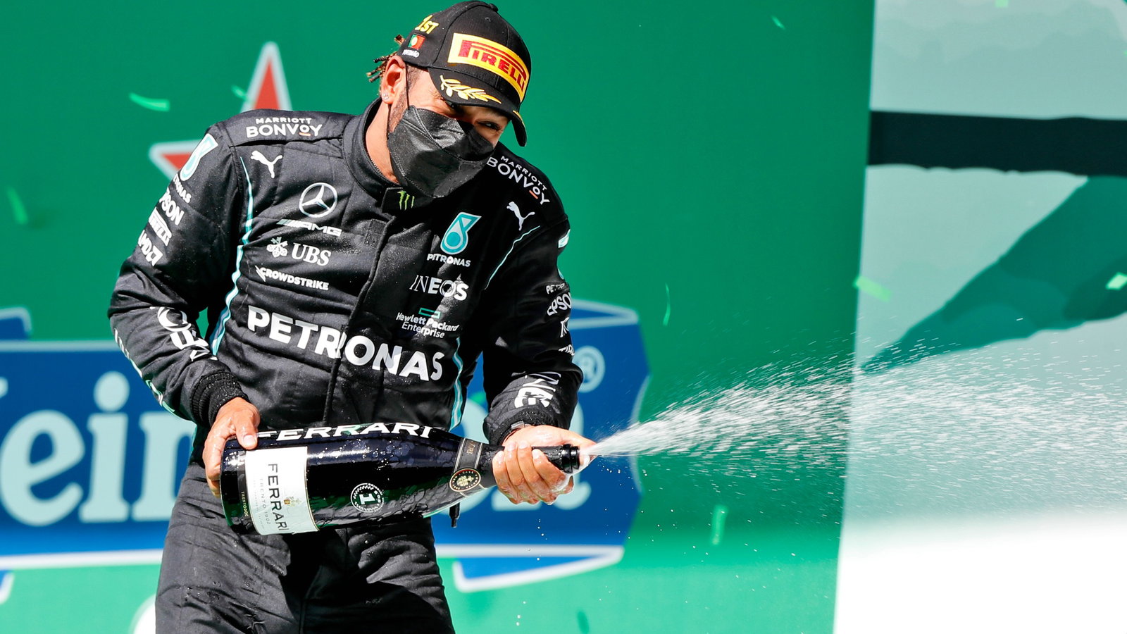 Race winner Lewis Hamilton (GBR) Mercedes AMG F1 celebrates on the podium.