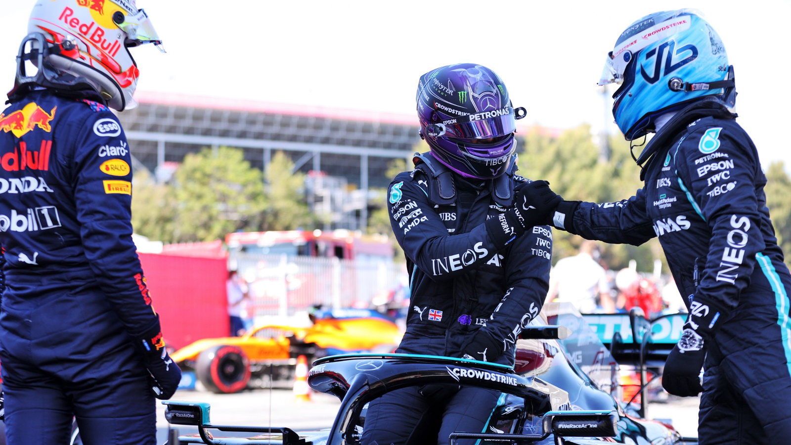 Lewis Hamilton (GBR) Mercedes AMG F1 W12 (Centre) celebrates his 100th pole position in qualifying parc ferme with team mate Valtteri Bottas (FIN) Mercedes AMG F1 (Right) and Max Verstappen (NLD) Red Bull Racing (Left).