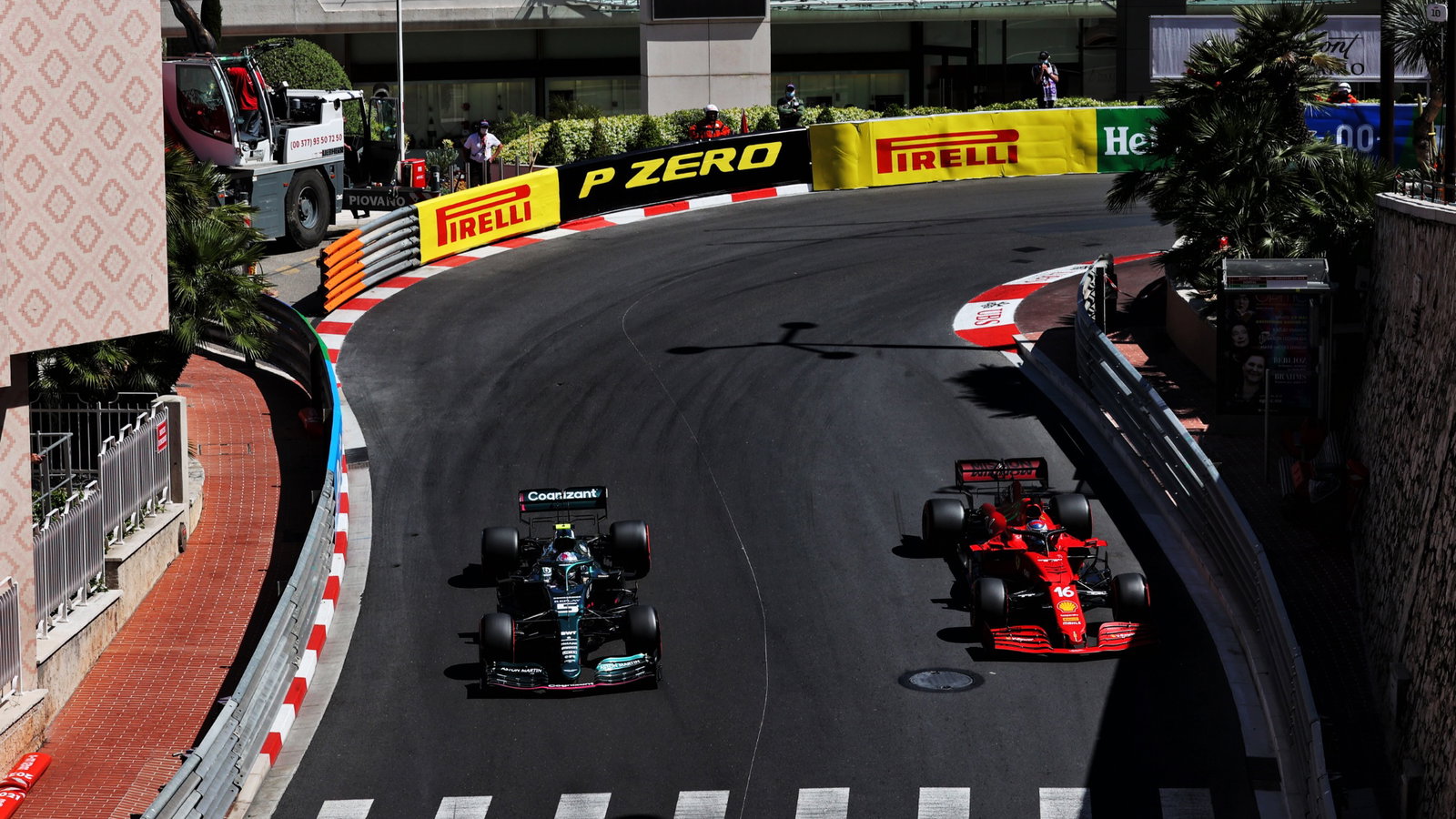 Sebastian Vettel (GER) Aston Martin F1 Team AMR21 and Charles Leclerc (MON) Ferrari SF-21.
