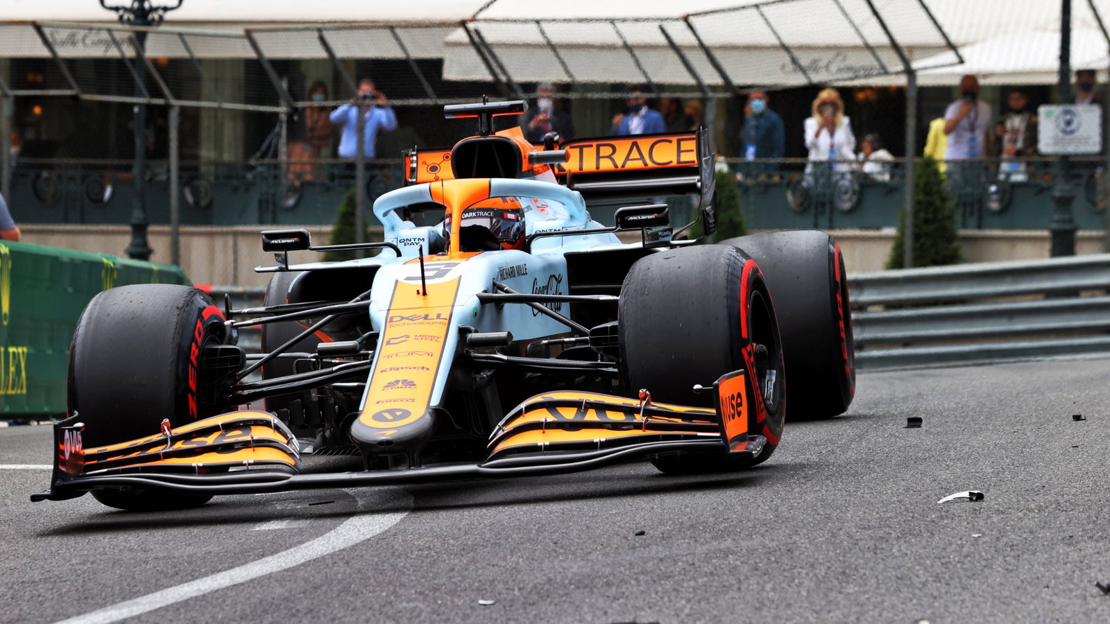 Daniel Ricciardo (AUS) McLaren MCL35M passes debris of Mick Schumacher (GER) Haas VF-21.