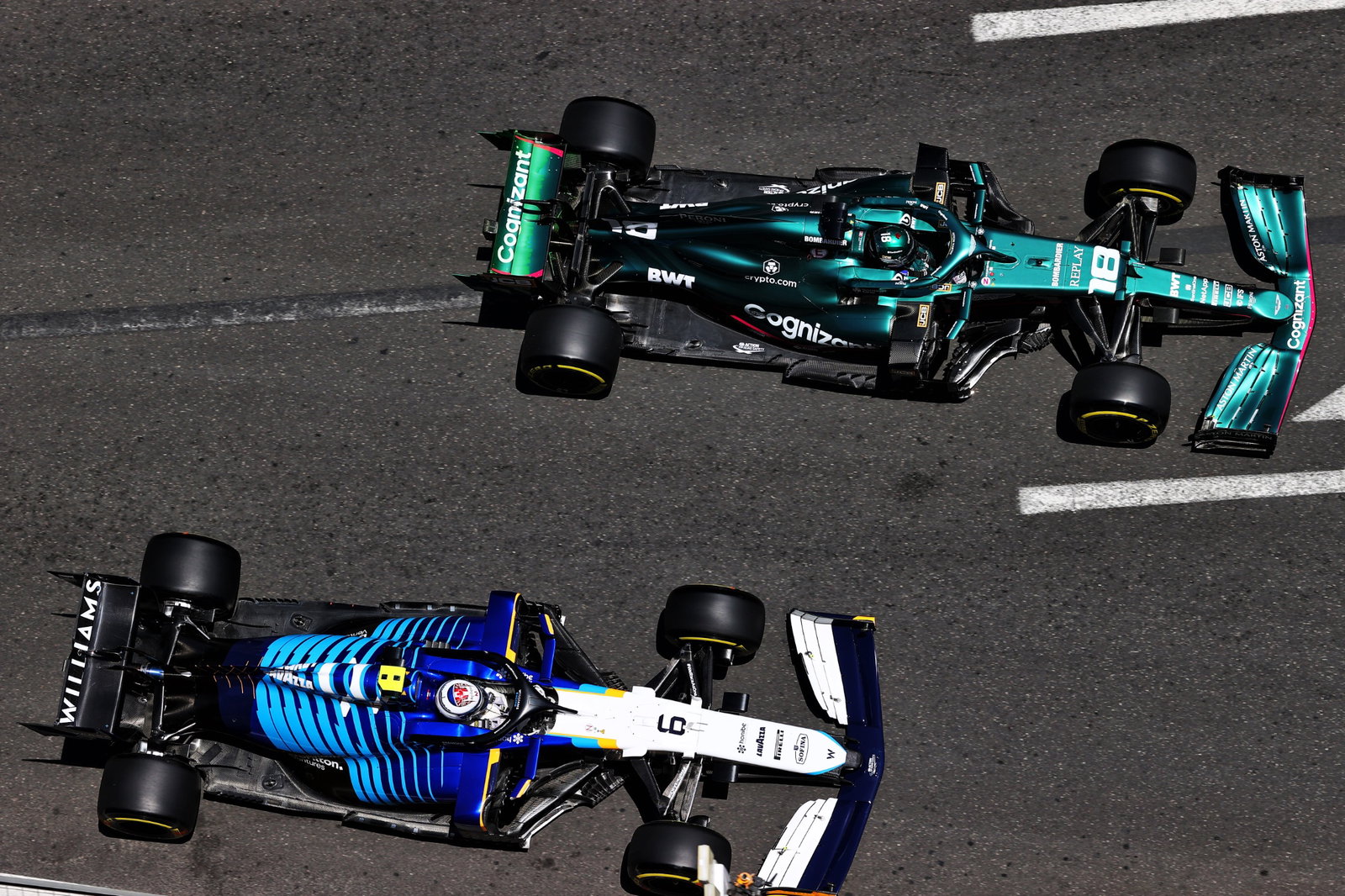 Lance Stroll (CDN) Aston Martin F1 Team AMR21 and Nicholas Latifi (CDN) Williams Racing FW43B.