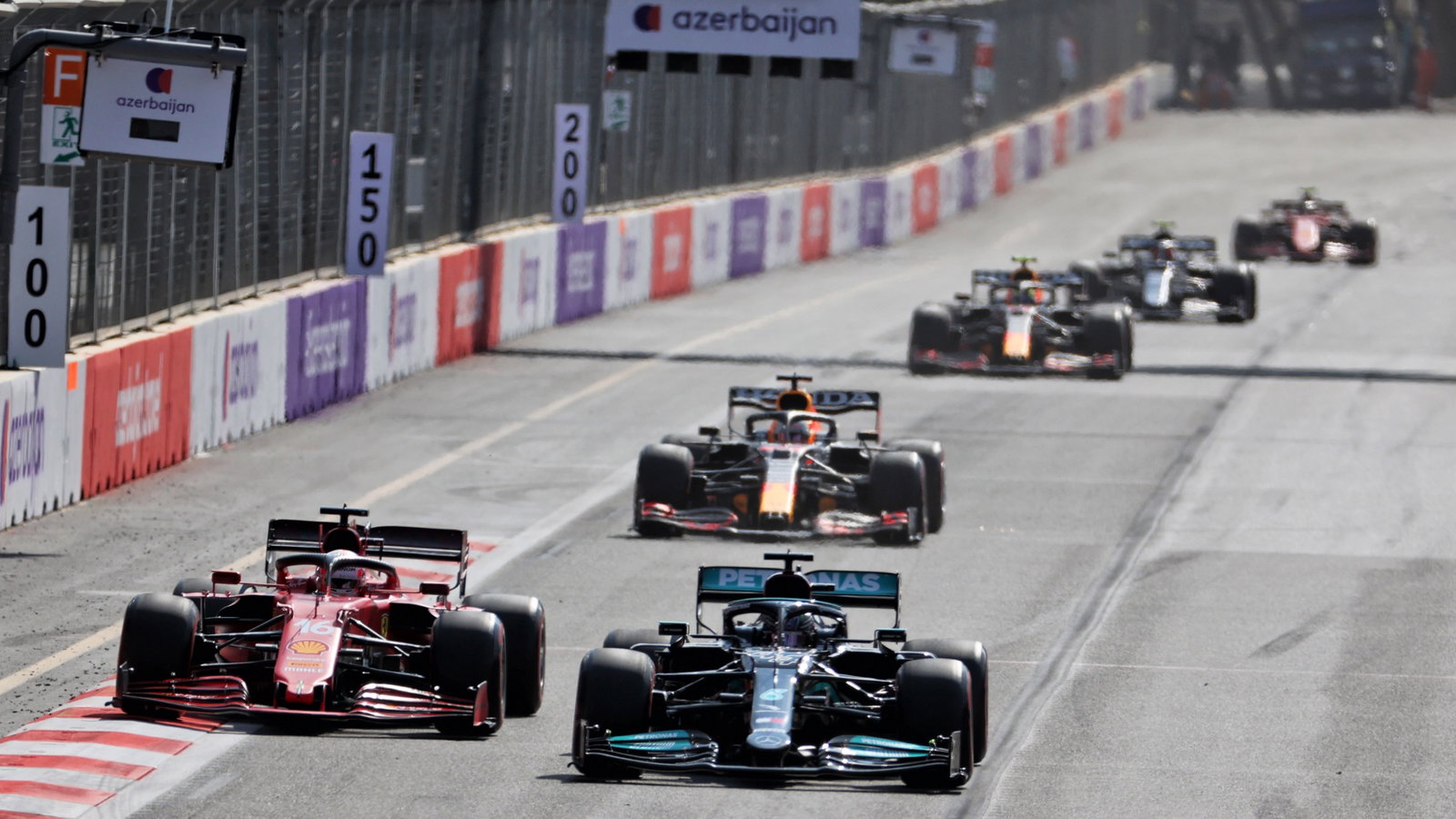 (L to R): Charles Leclerc (MON) Ferrari SF-21 and Lewis Hamilton (GBR) Mercedes AMG F1 W12 battle for position.