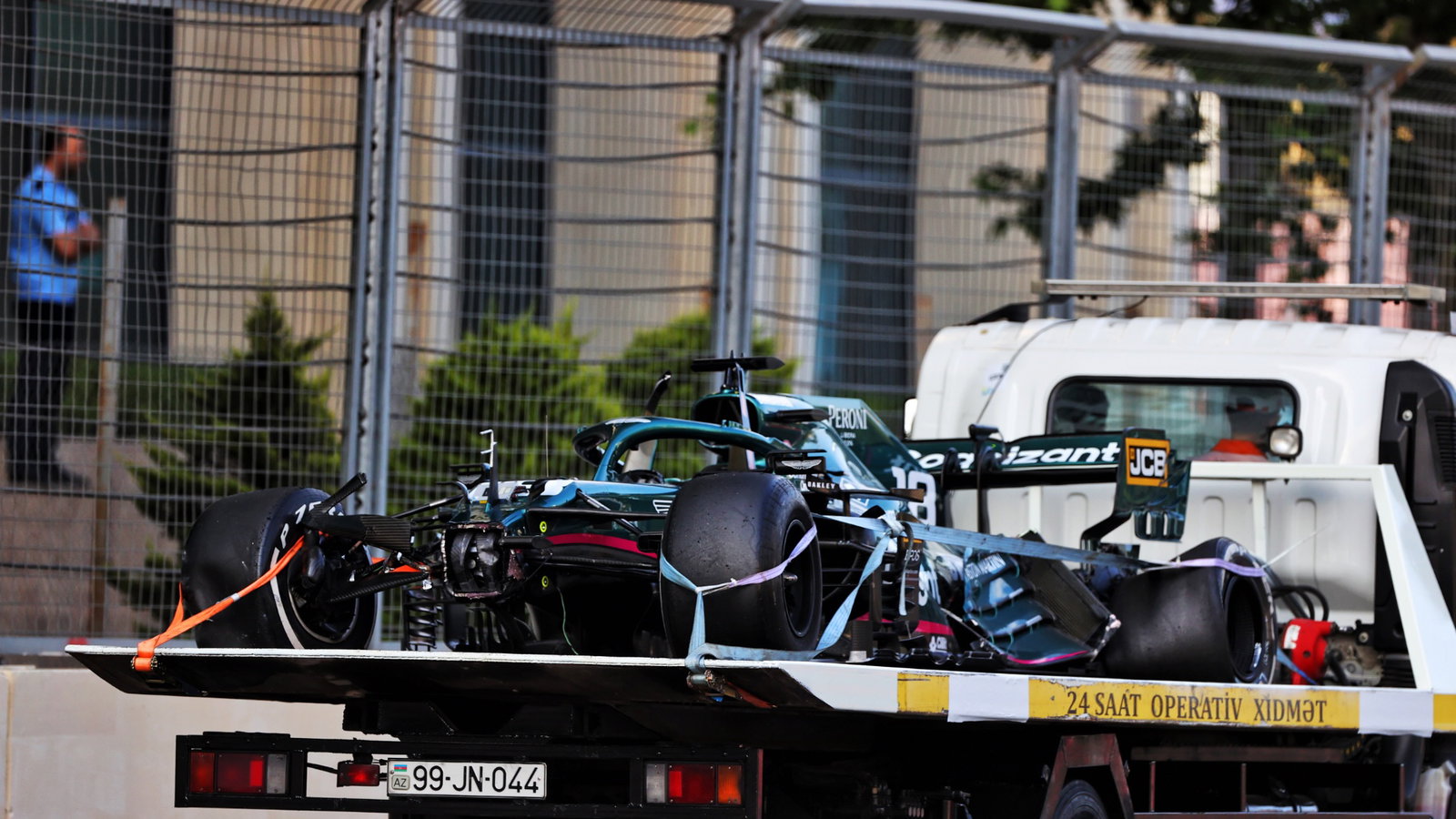 The Aston Martin F1 Team AMR21 of Lance Stroll (CDN) Aston Martin F1 Team is recovered back to the pits on the back of a truck after he crashed out of the race.