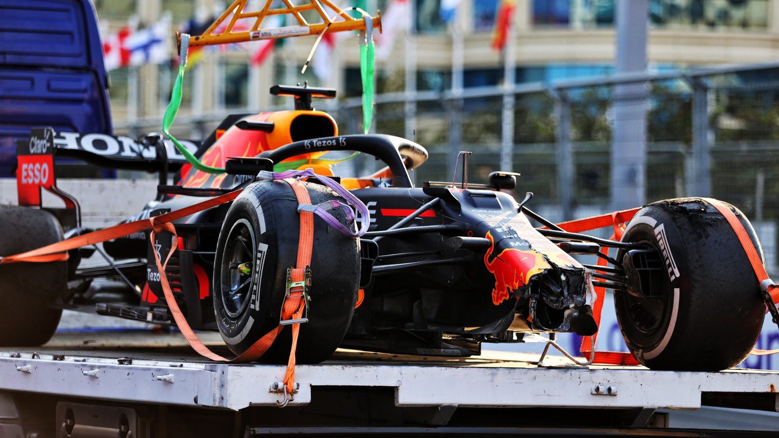 The Red Bull Racing RB16B of race retiree Max Verstappen (NLD) Red Bull Racing is recovered back to the pits on the back of a truck.