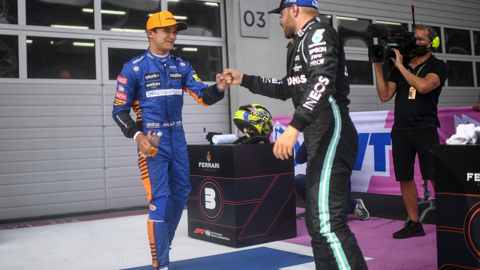 (L to R): Lando Norris (GBR) McLaren celebrates his third position in parc ferme with second placed Valtteri Bottas (FIN) Mercedes AMG F1.