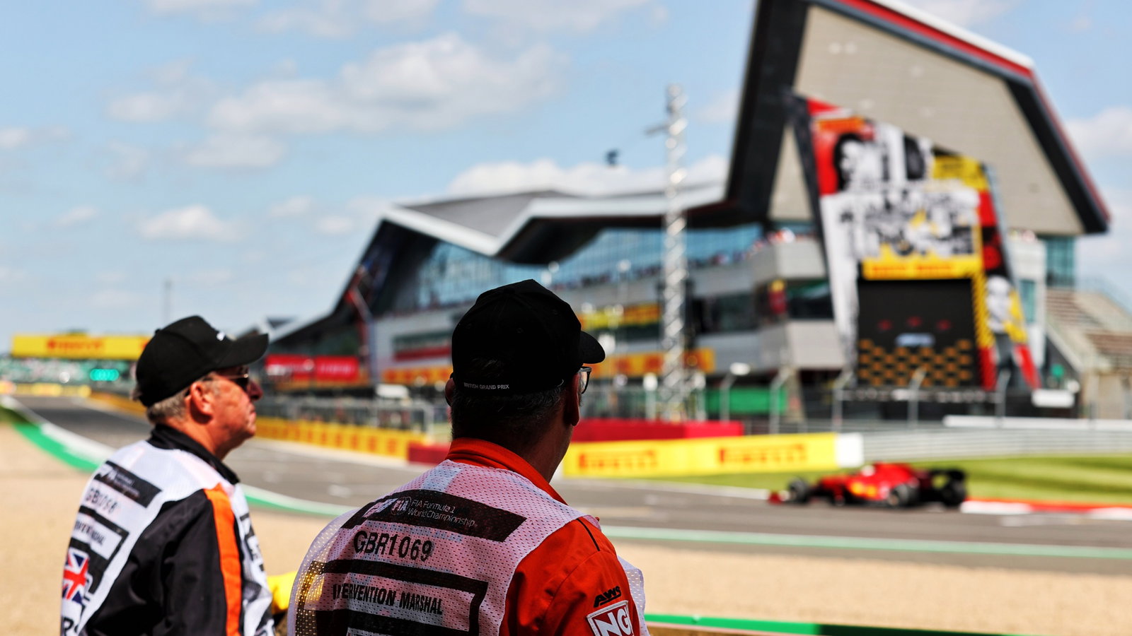 Circuit atmosphere - marshals trackside watch the action.