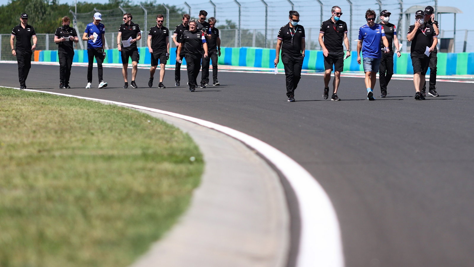 Fernando Alonso (ESP) Alpine F1 Team and Esteban Ocon (FRA) Alpine F1 Team walk the circuit with the team.