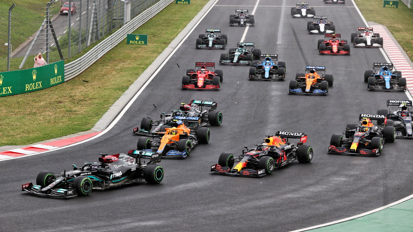 Lewis Hamilton (GBR) Mercedes AMG F1 W12 leads at the start of the race as Valtteri Bottas (FIN) Mercedes AMG F1 W12 crashes into the back of Lando Norris (GBR) McLaren MCL35M.