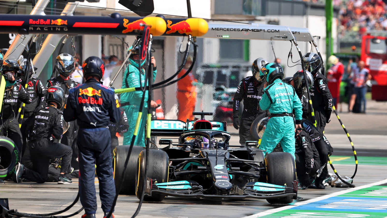 Lewis Hamilton (GBR) Mercedes AMG F1 W12 makes a pit stop.