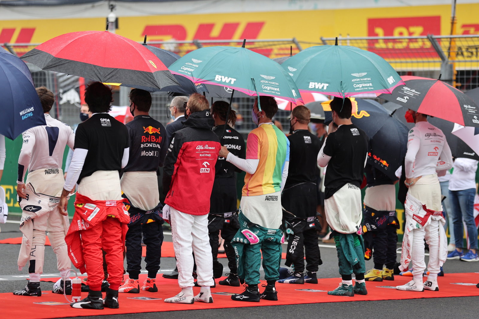 Sebastian Vettel (GER) Aston Martin F1 Team wearing a rainbow t-shirt as the grid observes the national anthem.