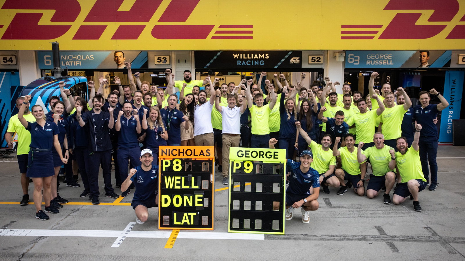 Nicholas Latifi (CDN) Williams Racing and George Russell (GBR) Williams Racing celebrate eighth position with the team.