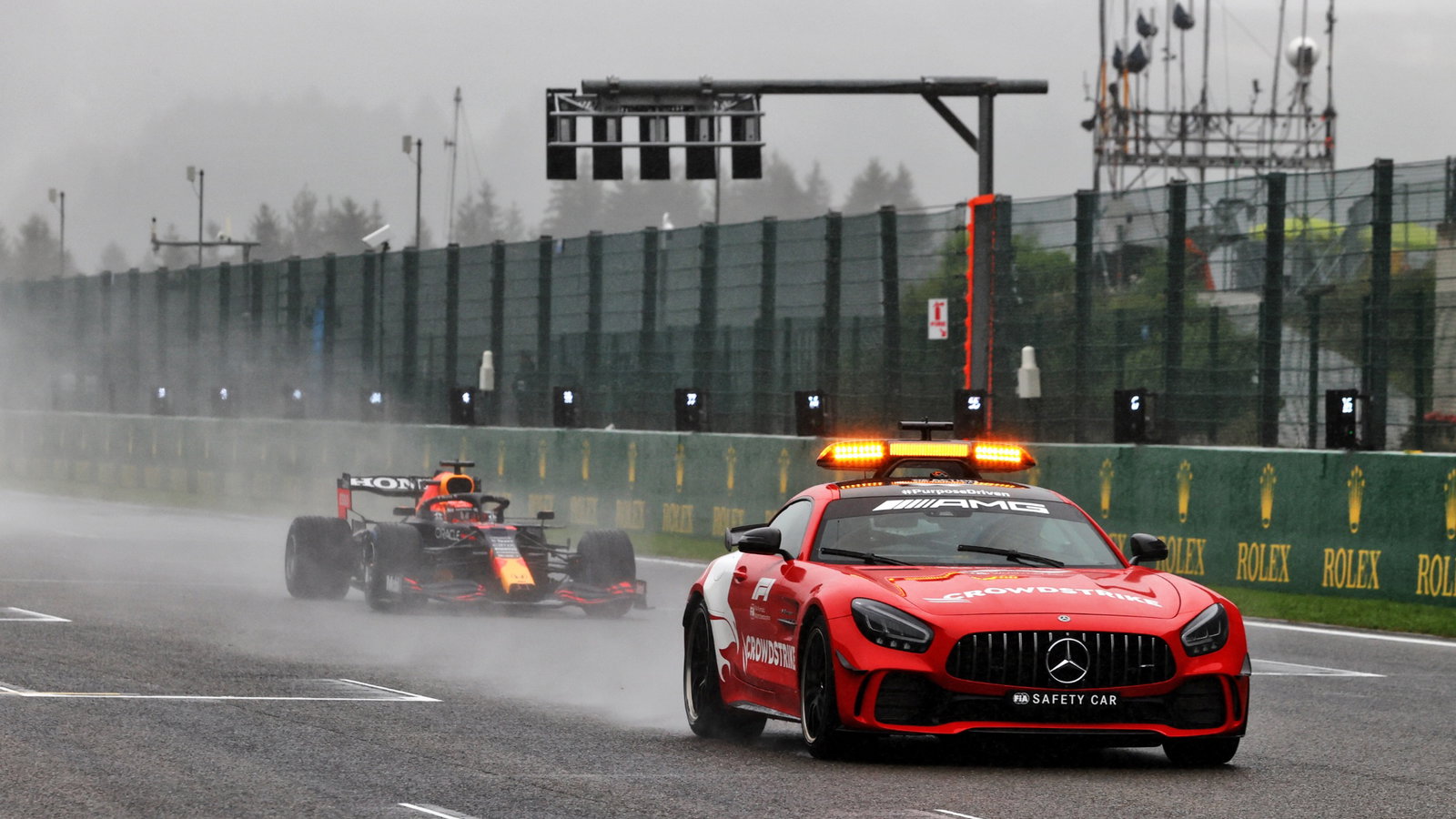 Max Verstappen (NLD) Red Bull Racing RB16B leads behind the Mercedes FIA Safety Car.