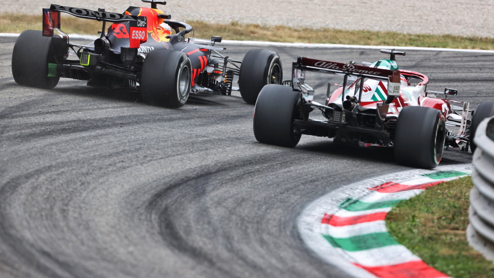 Max Verstappen (NLD) Red Bull Racing RB16B and Robert Kubica (POL) Alfa Romeo Racing C39 Reserve Driver.