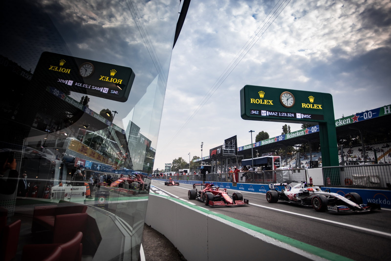 Charles Leclerc (MON) Ferrari SF-21 and Nikita Mazepin (RUS) Haas F1 Team VF-21 leave the pits.