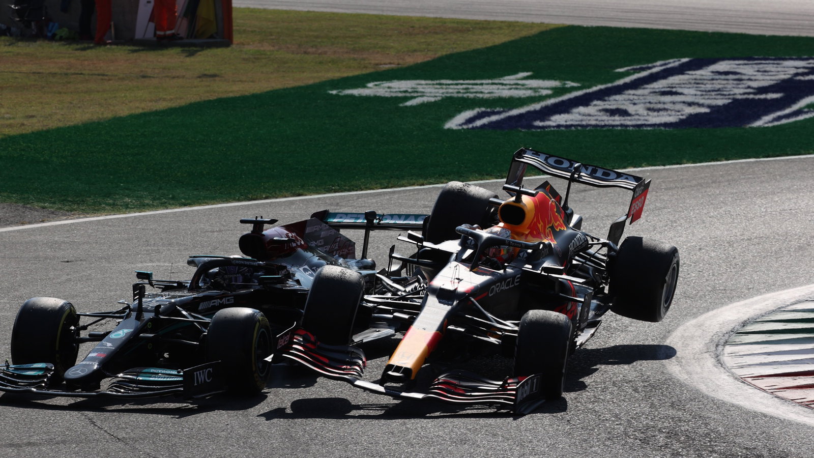 Max Verstappen (NLD) Red Bull Racing RB16B and Lewis Hamilton (GBR) Mercedes AMG F1 W12 crash at the first chicane.