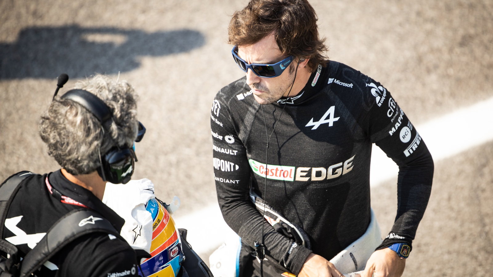 Fernando Alonso (ESP) Alpine F1 Team with Edoardo Bendinelli (ITA) Alpine F1 Team Personal Trainer on the grid.