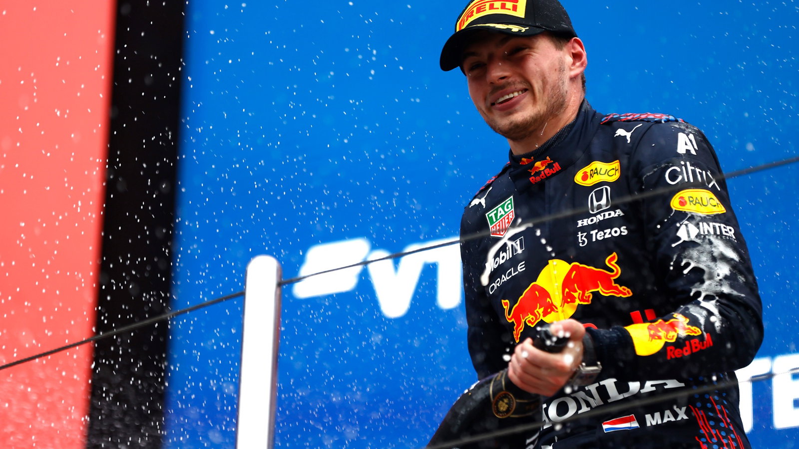 Max Verstappen (NLD) Red Bull Racing celebrates his second position on the podium.
