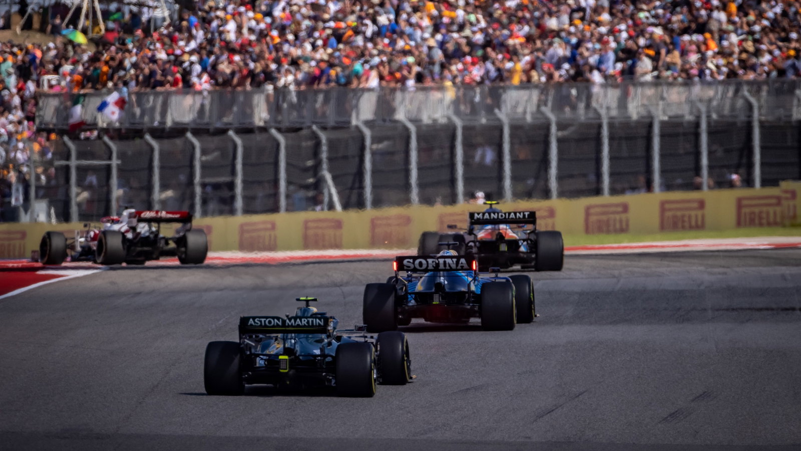 George Russell (GBR) Williams Racing FW43B leads Sebastian Vettel (GER) Aston Martin F1 Team AMR21.