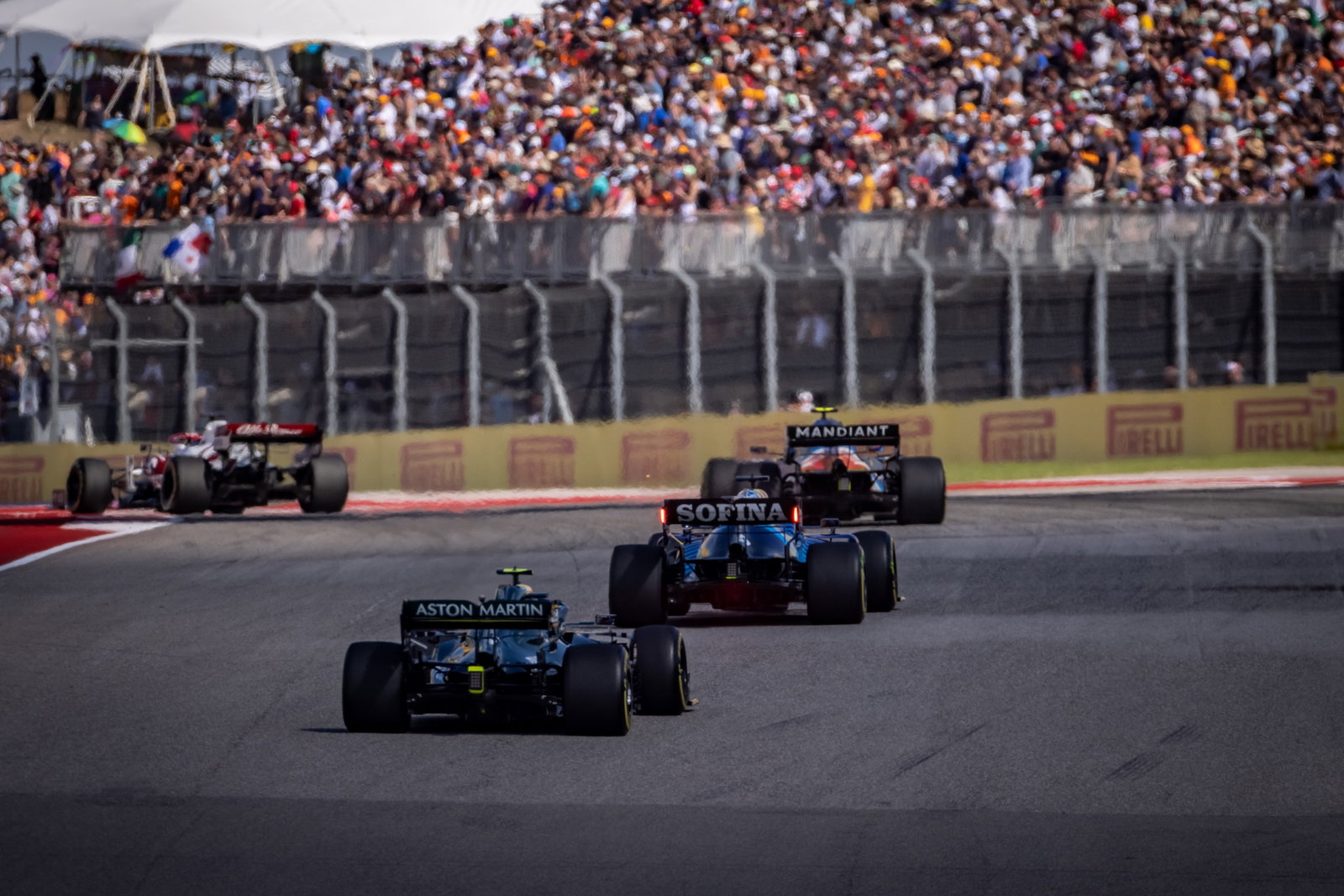 George Russell (GBR) Williams Racing FW43B leads Sebastian Vettel (GER) Aston Martin F1 Team AMR21.