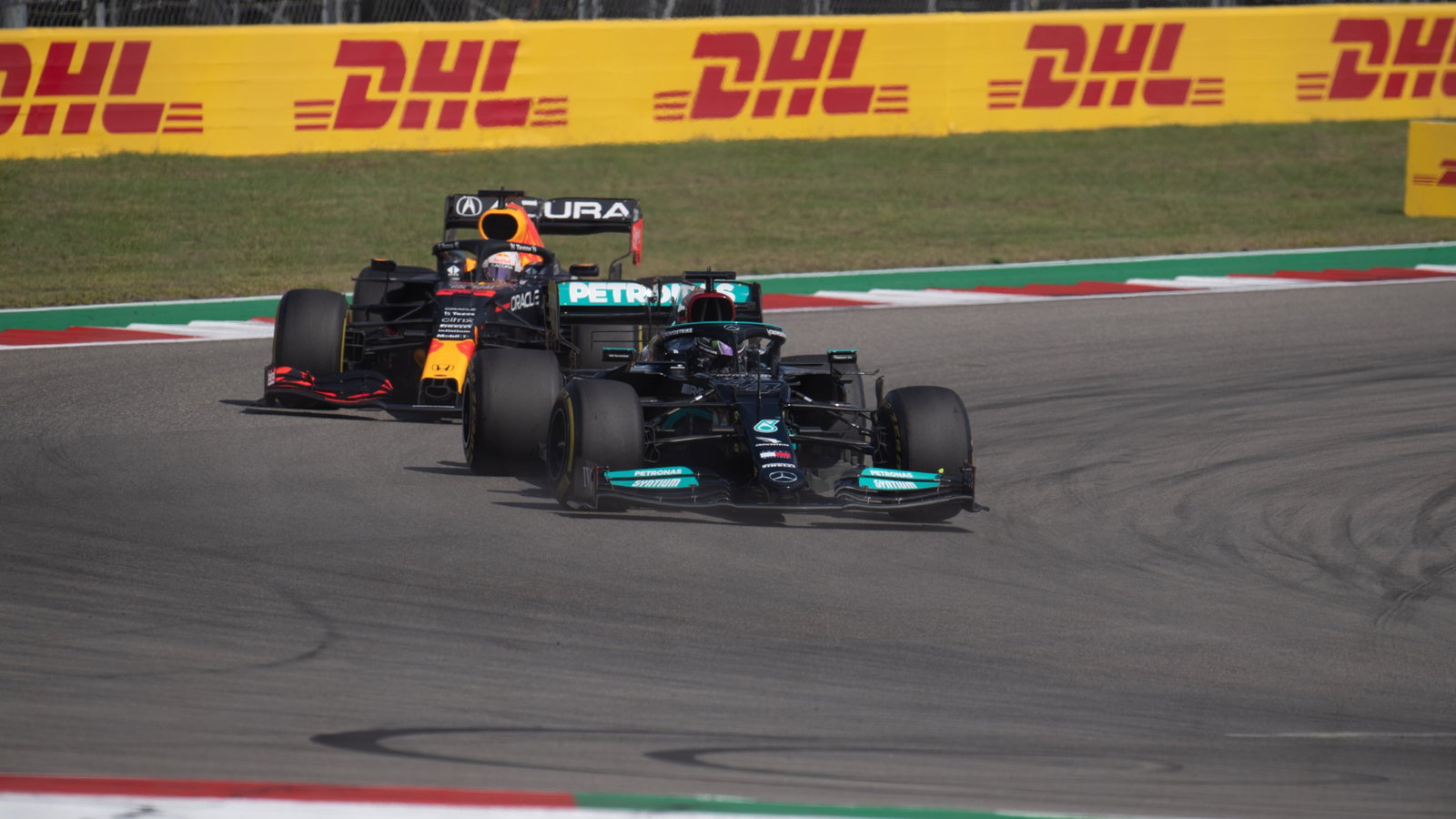 Lewis Hamilton (GBR) Mercedes AMG F1 W12 leads Max Verstappen (NLD) Red Bull Racing RB16B.