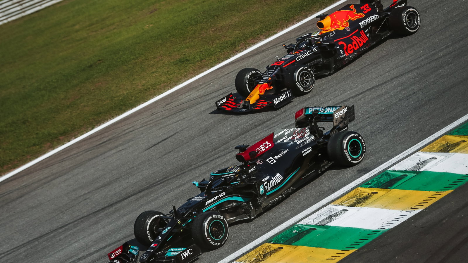 Lewis Hamilton (GBR) Mercedes AMG F1 W12 and Max Verstappen (NLD) Red Bull Racing RB16B.