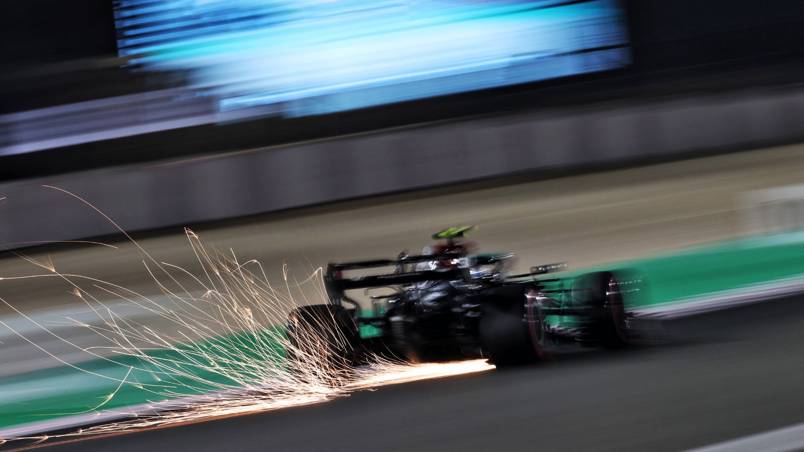 Valtteri Bottas (FIN) Mercedes AMG F1 W12 sends sparks flying.