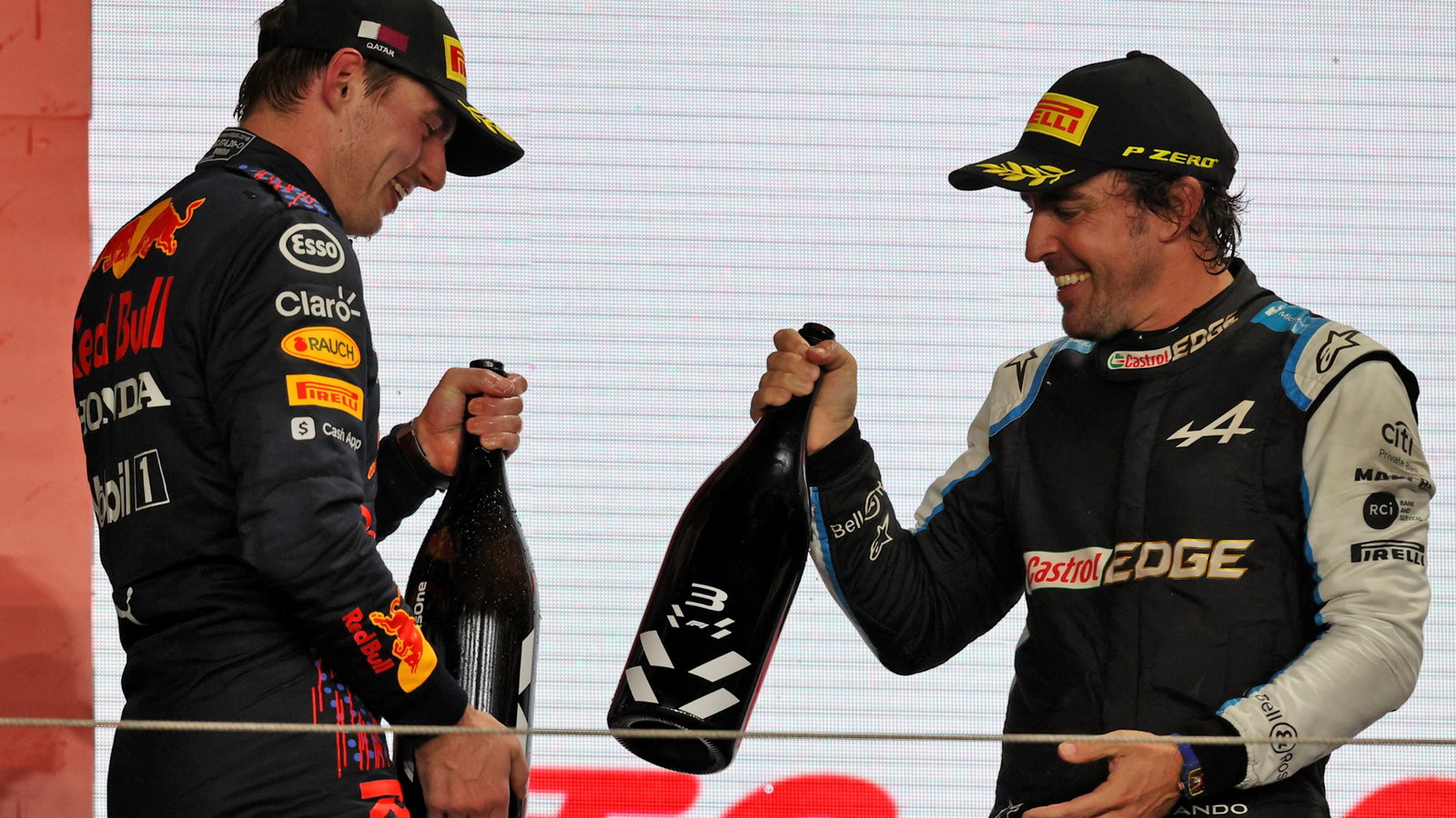 (L to R): Max Verstappen (NLD) Red Bull Racing celebrates his second position with third placed Fernando Alonso (ESP) Alpine F1 Team on the podium.