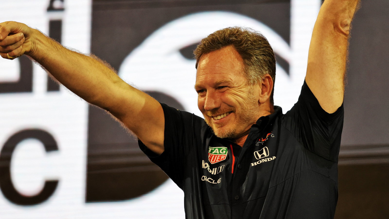 Christian Horner (GBR) Red Bull Racing Team Principal celebrates on the podium.