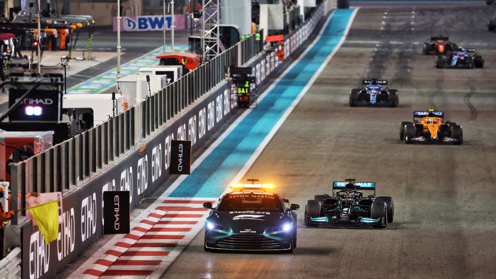 Lewis Hamilton (GBR) Mercedes AMG F1 W12 leads behind the Aston Martin FIA Safety Car.